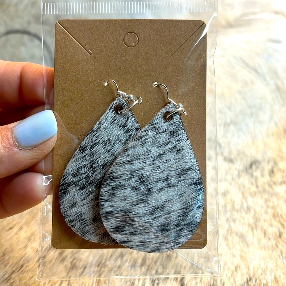 Teardrop cowhide custom earrings. Beautiful white black authentic hide.